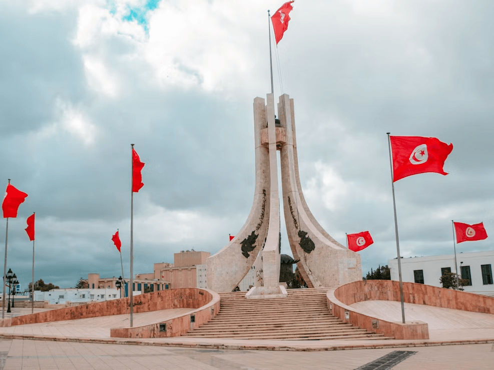 Flag of Tunisia around a monument